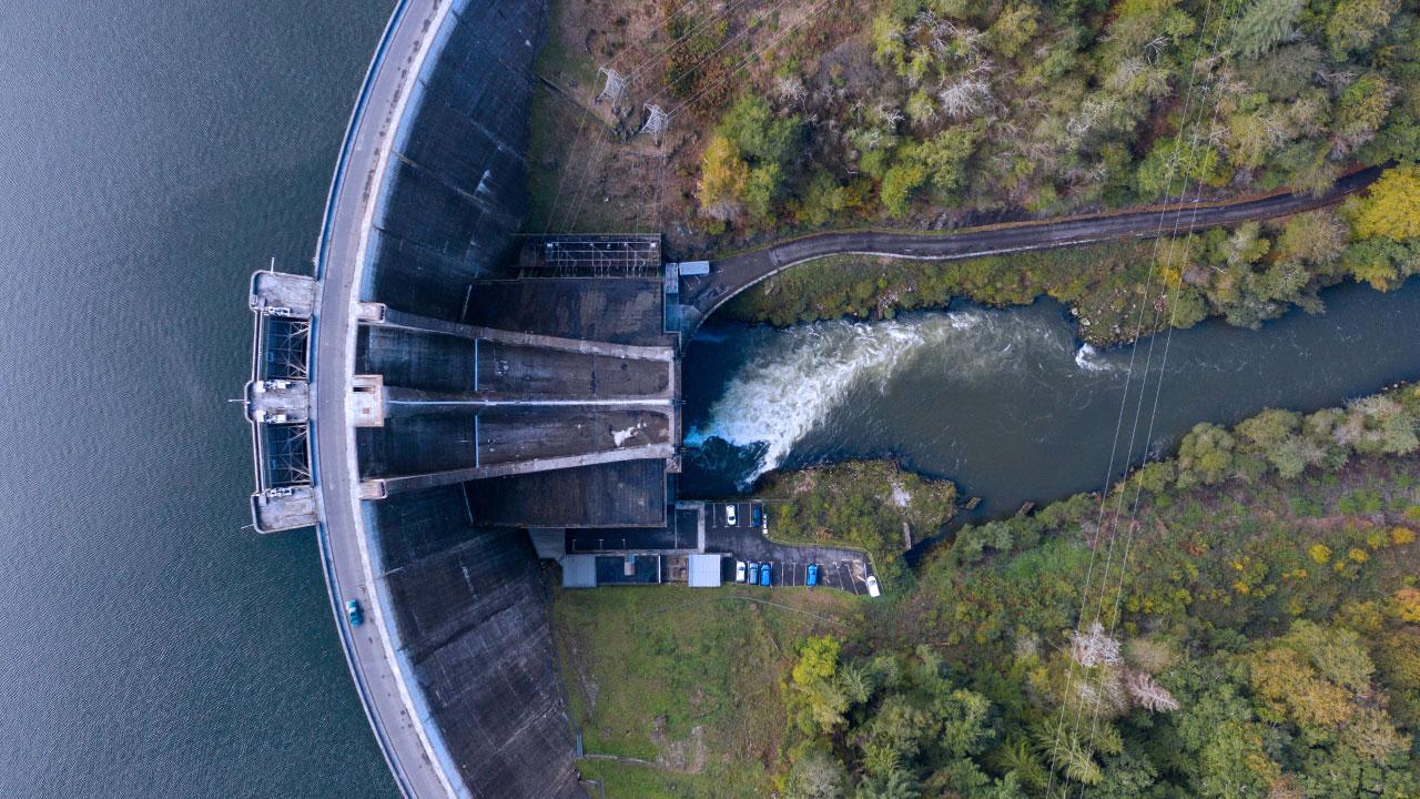 Overhead view of a hydropower dam and facility