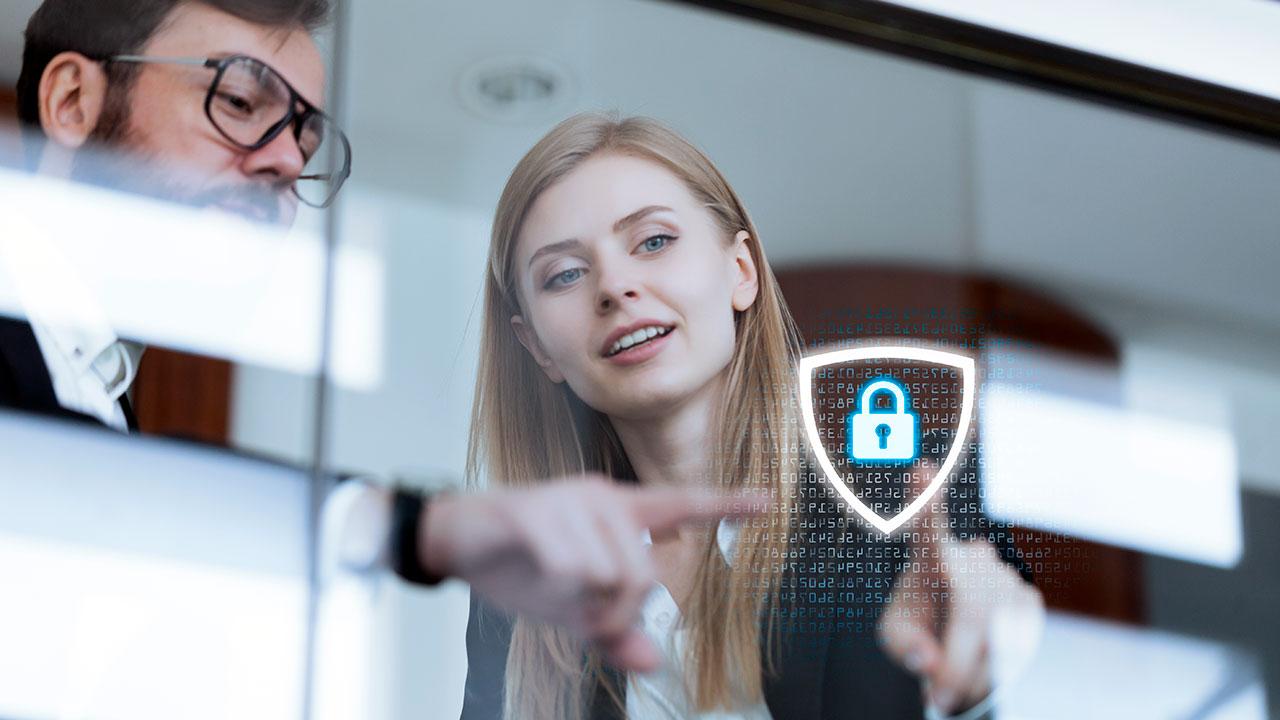 Two people pointing at floating digital padlock