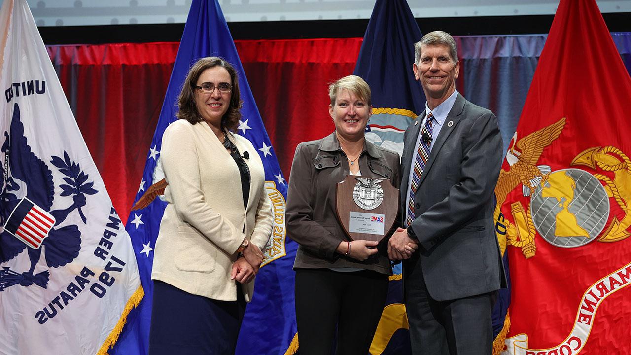 Tetra Tech employee receiving the SAME Large Business Award from two people