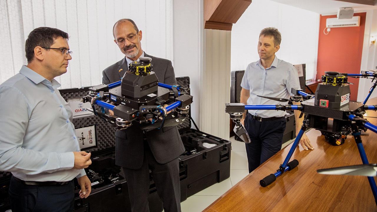 USAID Moldova Mission Director Jeff Bryan inspects drone equipment provided to Moldova’s electricity transmission system operator, Moldelectrica